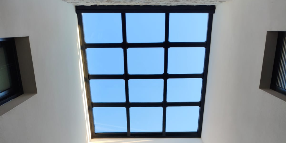techo de cristal como lucernario de una vivienda